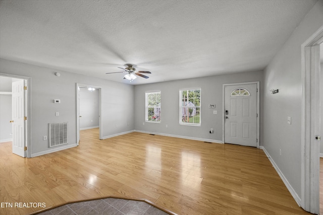 710 E Fir St, Lafollette, TN 37766 - entryway with a ceiling fan, light wood-style floors, and a textured ceiling