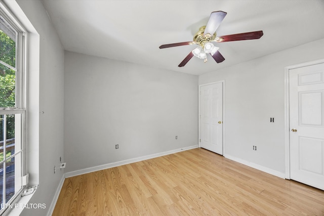 710 E Fir St, Lafollette, TN 37766 - unfurnished bedroom featuring light wood-style floors and ceiling fan