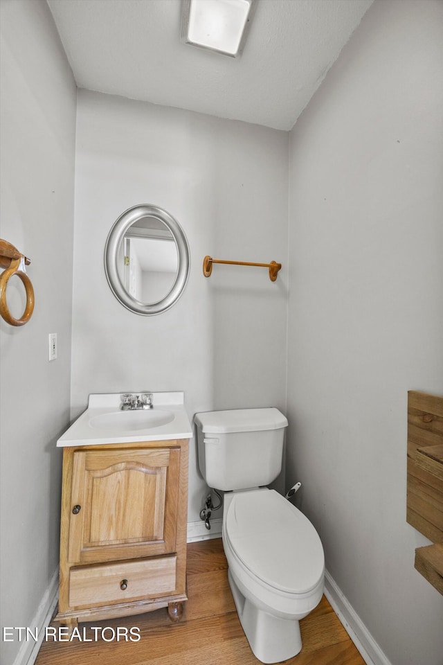 710 E Fir St, Lafollette, TN 37766 - half bathroom with vanity and wood finished floors