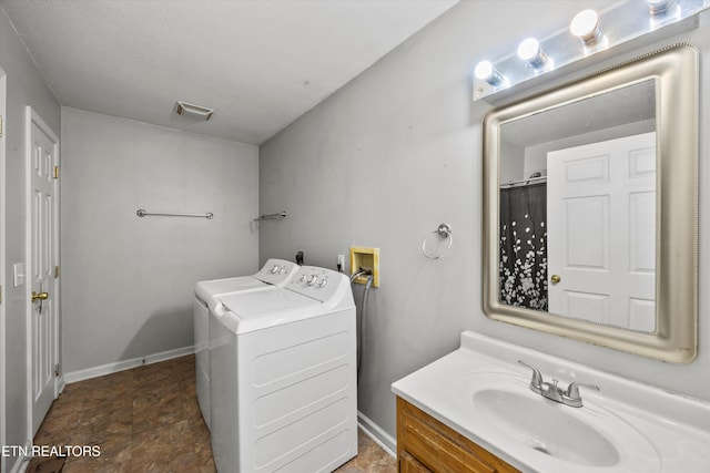 710 E Fir St, Lafollette, TN 37766 - full bathroom with vanity, washer and clothes dryer, and stone finish floors