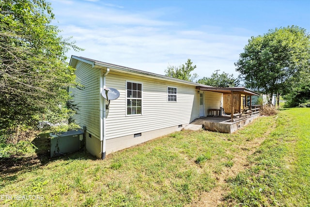 710 E Fir St, Lafollette, TN 37766 - back of house featuring crawl space and a lawn