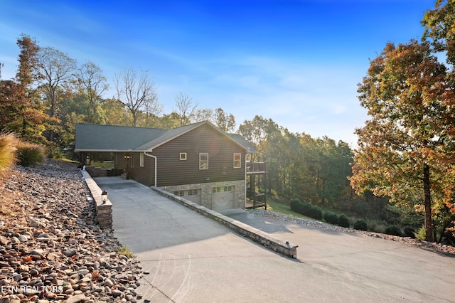 836 Sandra Way, Kodak, TN 37764 - view of side of property featuring driveway, stone siding, and a garage