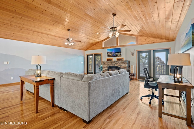 836 Sandra Way, Kodak, TN 37764 - living area featuring a stone fireplace, vaulted ceiling, wooden ceiling, ceiling fan, and light wood-style flooring