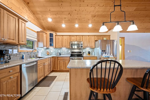 836 Sandra Way, Kodak, TN 37764 - kitchen with stainless steel appliances, wooden ceiling, tasteful backsplash, a kitchen bar, and light tile patterned floors