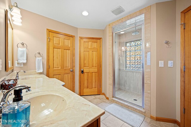 836 Sandra Way, Kodak, TN 37764 - bathroom with double vanity, a stall shower, tile patterned flooring, and recessed lighting