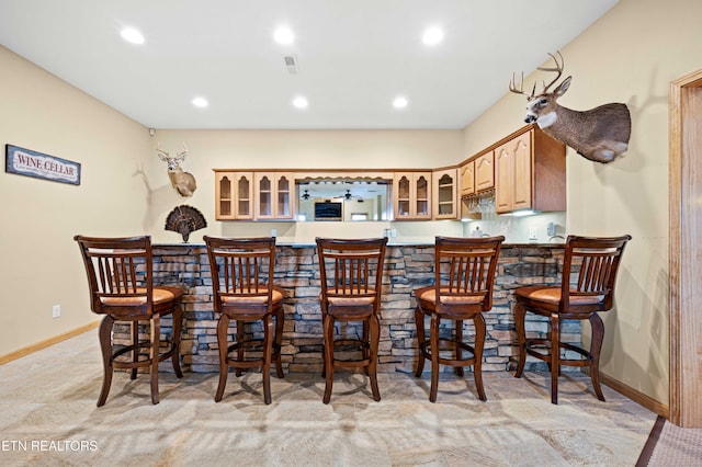 836 Sandra Way, Kodak, TN 37764 - kitchen with glass insert cabinets, recessed lighting, a breakfast bar, and a peninsula