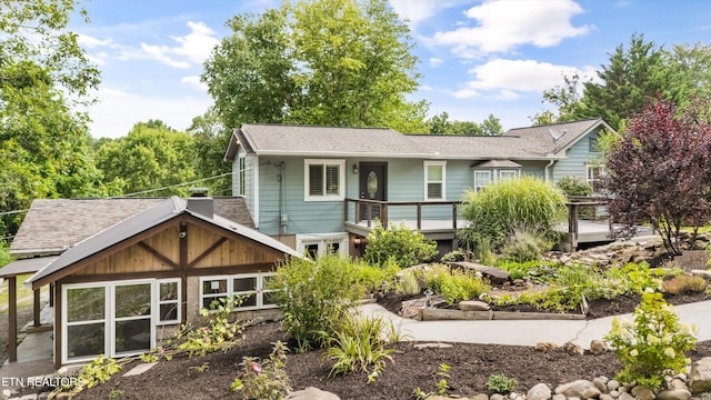 976 Lone Rd, Pioneer, TN 37847 - rear view of house with a garden, a deck, and roof with shingles