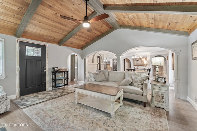 976 Lone Rd, Pioneer, TN 37847 - living room with arched walkways, ornate columns, wood finished floors, wooden ceiling, and ceiling fan