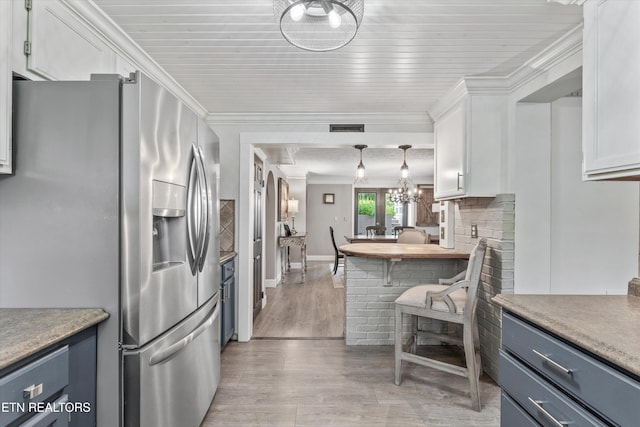 976 Lone Rd, Pioneer, TN 37847 - kitchen featuring stainless steel refrigerator with ice dispenser, white cabinetry, light wood-style flooring, light countertops, and crown molding