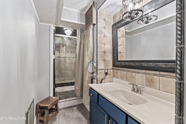 976 Lone Rd, Pioneer, TN 37847 - full bath with ornamental molding, wood finished floors, a stall shower, a chandelier, and vanity