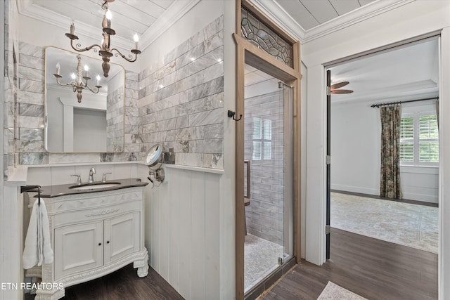 976 Lone Rd, Pioneer, TN 37847 - bathroom featuring ornamental molding, vanity, wood finished floors, a stall shower, and a chandelier