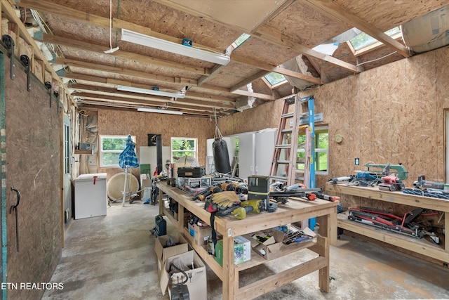 976 Lone Rd, Pioneer, TN 37847 - miscellaneous room with a workshop area, unfinished concrete floors, and a skylight