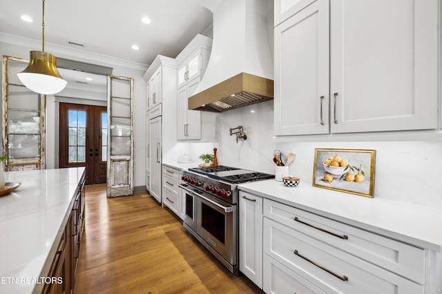 1014 High Springs Rd, Knoxville, TN 37932 - kitchen with range with two ovens, premium range hood, light countertops, french doors, and recessed lighting