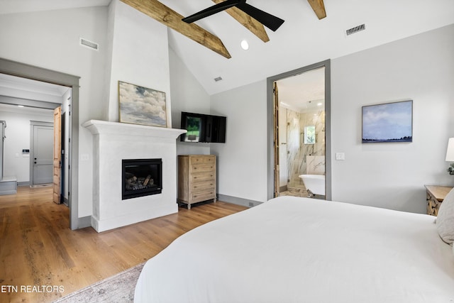 1014 High Springs Rd, Knoxville, TN 37932 - bedroom featuring a glass covered fireplace, wood finished floors, high vaulted ceiling, connected bathroom, and beam ceiling