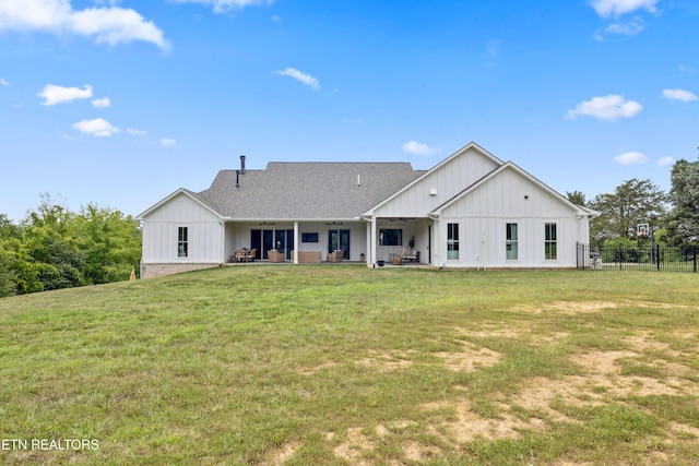 1014 High Springs Rd, Knoxville, TN 37932 - rear view of property with board and batten siding, a ceiling fan, a patio, and roof with shingles