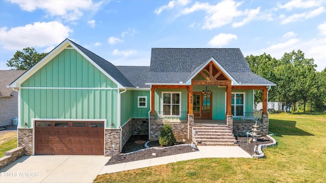 487 Peninsula, Rutledge, TN 37861 - view of front of property featuring board and batten siding, covered porch, a front lawn, concrete driveway, and roof with shingles