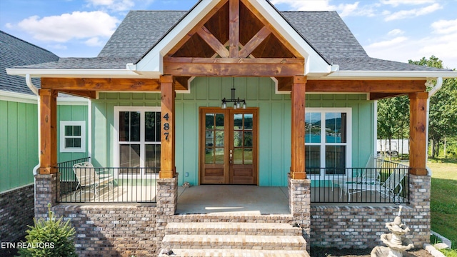487 Peninsula, Rutledge, TN 37861 - doorway to property with covered porch, roof with shingles, and board and batten siding