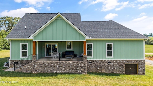 487 Peninsula, Rutledge, TN 37861 - rear view of house featuring a lawn, a shingled roof, and board and batten siding