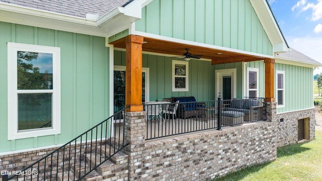 487 Peninsula, Rutledge, TN 37861 - view of exterior entry featuring roof with shingles, a ceiling fan, and board and batten siding
