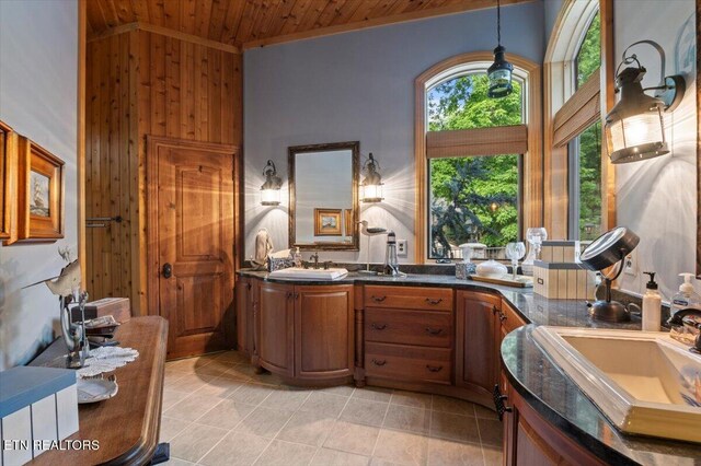 311 Deerwood Ln, Lafollette, TN 37766 - full bathroom with wood ceiling, vanity, wooden walls, high vaulted ceiling, and tile patterned floors