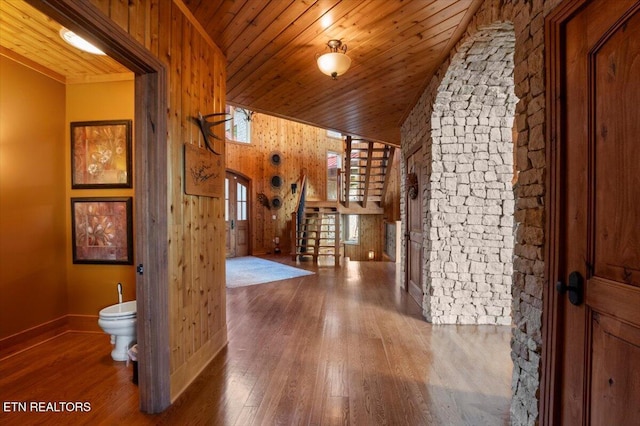 311 Deerwood Ln, Lafollette, TN 37766 - hall with wood ceiling, hardwood / wood-style flooring, wood walls, lofted ceiling, and stairs