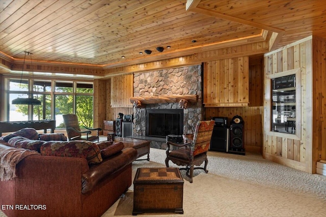 311 Deerwood Ln, Lafollette, TN 37766 - carpeted living room with wooden ceiling, a raised ceiling, wooden walls, crown molding, and a fireplace