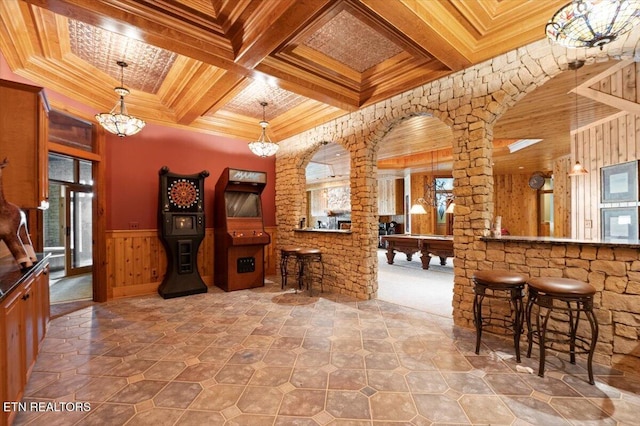 311 Deerwood Ln, Lafollette, TN 37766 - tiled living area with crown molding, arched walkways, coffered ceiling, wainscoting, and beam ceiling