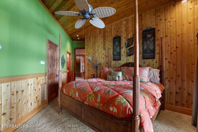 311 Deerwood Ln, Lafollette, TN 37766 - bedroom featuring wooden walls, carpet, wood ceiling, and a wainscoted wall