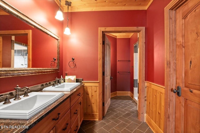 311 Deerwood Ln, Lafollette, TN 37766 - full bath with a wainscoted wall, double vanity, and wooden walls
