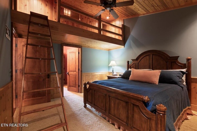 311 Deerwood Ln, Lafollette, TN 37766 - bedroom featuring wooden walls, wooden ceiling, light colored carpet, and wainscoting