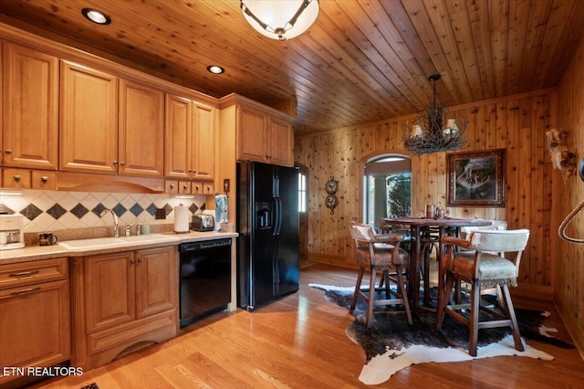 311 Deerwood Ln, Lafollette, TN 37766 - kitchen with black appliances, arched walkways, light wood-style floors, wooden ceiling, and backsplash