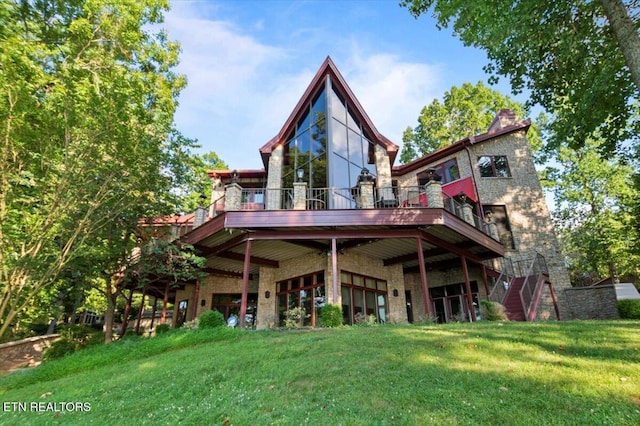 311 Deerwood Ln, Lafollette, TN 37766 - back of property featuring a wooden deck, a yard, stone siding, and brick siding