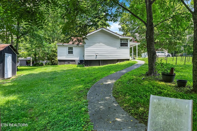121 N Niota Rd, Englewood, TN 37329 - view of green lawn with an outbuilding