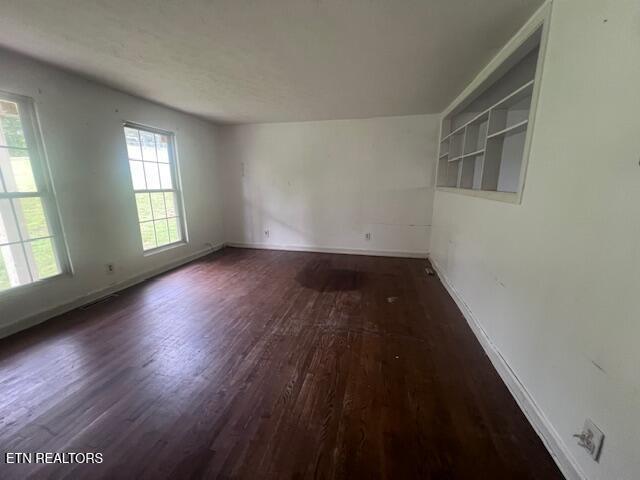 114 Red Cedar Rd, Lafollette, TN 37766 - spare room with dark wood-style flooring and baseboards