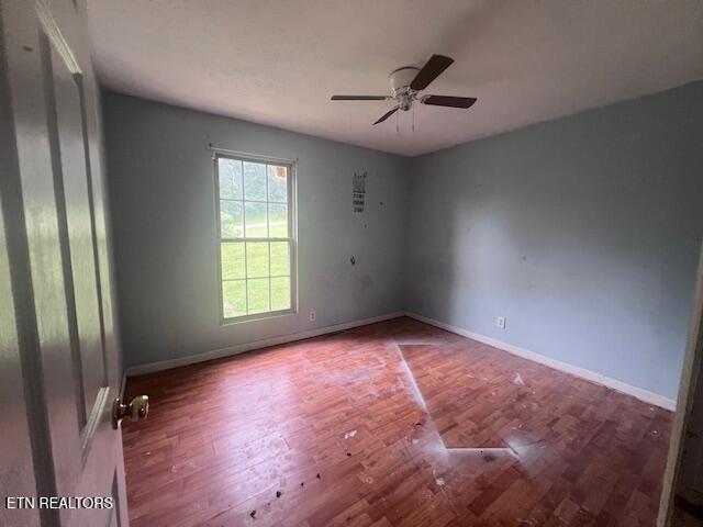 114 Red Cedar Rd, Lafollette, TN 37766 - empty room with wood finished floors and ceiling fan