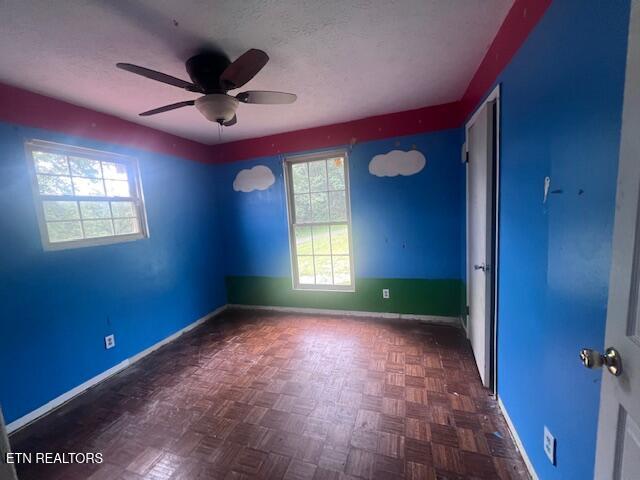 114 Red Cedar Rd, Lafollette, TN 37766 - spare room featuring ceiling fan and a textured ceiling