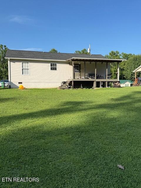 122 Regan Ln, Lafollette, TN 37766 - back of house featuring a yard and crawl space
