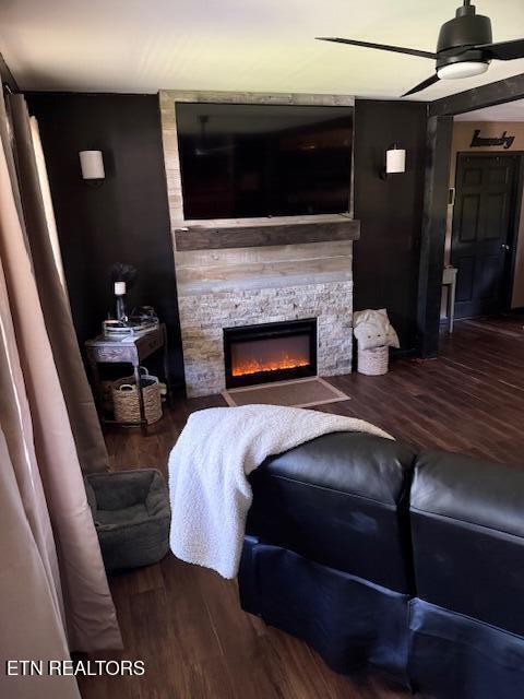 122 Regan Ln, Lafollette, TN 37766 - living room featuring ceiling fan, wood finished floors, and a stone fireplace