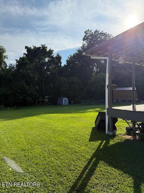 122 Regan Ln, Lafollette, TN 37766 - view of grassy yard featuring a storage unit