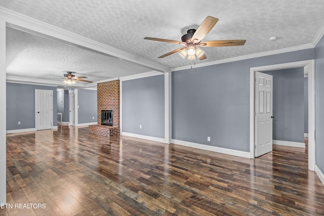 221 Greer Ln, Tazewell, TN 37879 - unfurnished living room with ceiling fan, a textured ceiling, wood finished floors, and a brick fireplace