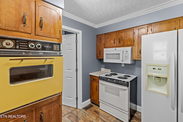 221 Greer Ln, Tazewell, TN 37879 - kitchen with white appliances, crown molding, brown cabinets, a textured ceiling, and wood finished floors