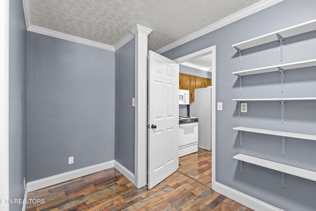 221 Greer Ln, Tazewell, TN 37879 - unfurnished room featuring dark wood-style flooring, ornamental molding, and a textured ceiling