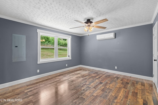 221 Greer Ln, Tazewell, TN 37879 - spare room with electric panel, an AC wall unit, a ceiling fan, wood-type flooring, and crown molding