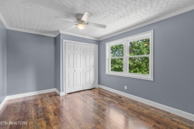 221 Greer Ln, Tazewell, TN 37879 - unfurnished bedroom featuring dark wood-style floors, a closet, ceiling fan, and a textured ceiling