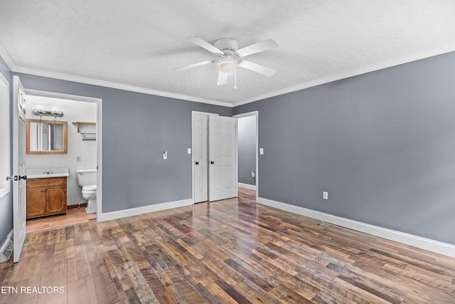 221 Greer Ln, Tazewell, TN 37879 - unfurnished bedroom with hardwood / wood-style floors, connected bathroom, crown molding, and a ceiling fan