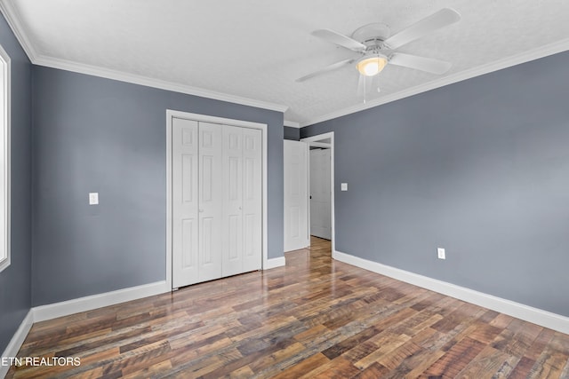 221 Greer Ln, Tazewell, TN 37879 - unfurnished bedroom featuring wood finished floors, a closet, a ceiling fan, and crown molding