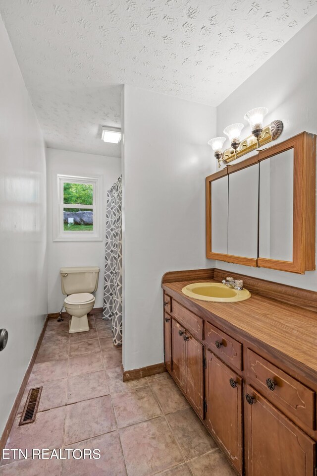 221 Greer Ln, Tazewell, TN 37879 - bathroom with vanity, tile patterned floors, and a textured ceiling