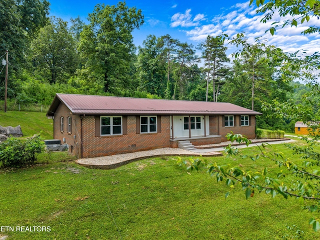 221 Greer Ln, Tazewell, TN 37879 - ranch-style home with brick siding, a front yard, and a metal roof