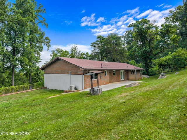 221 Greer Ln, Tazewell, TN 37879 - back of property with a patio area and a yard