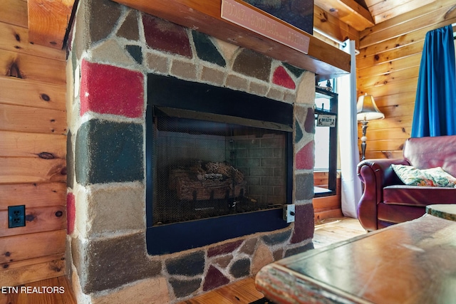 1130 Sharp Rd, Sevierville, TN 37876 - detailed view of a stone fireplace, wood finished floors, and wooden walls